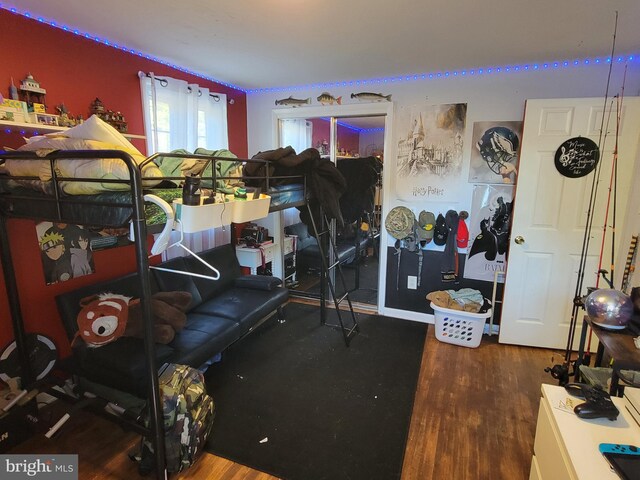 bedroom featuring dark hardwood / wood-style flooring