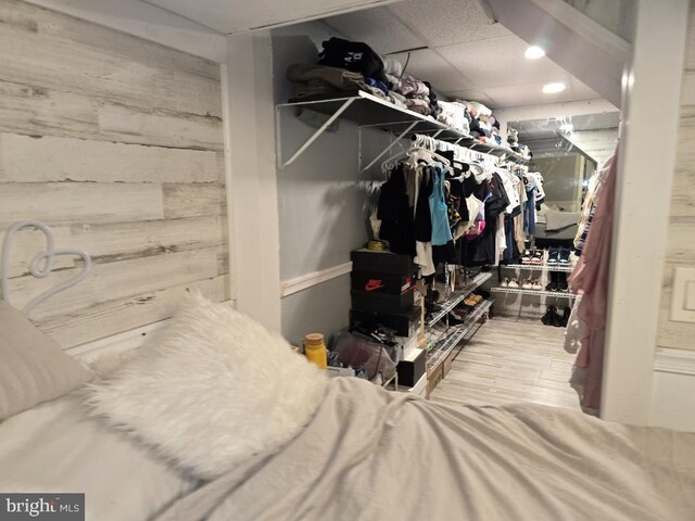 spacious closet featuring hardwood / wood-style flooring