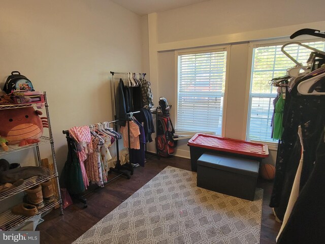 misc room with dark wood-type flooring