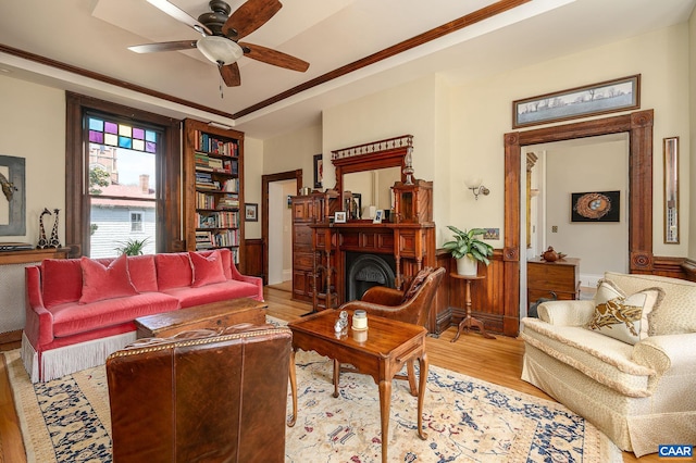 living room with hardwood / wood-style flooring and ceiling fan