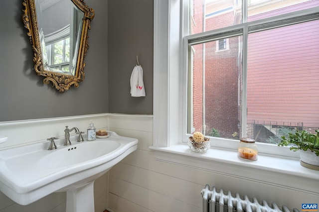 bathroom with sink and radiator heating unit