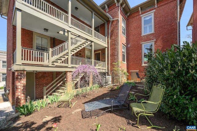 rear view of house featuring a balcony