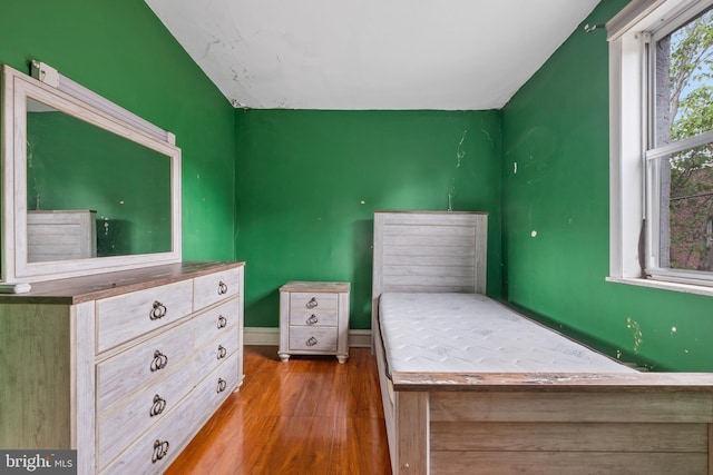 unfurnished bedroom featuring hardwood / wood-style flooring