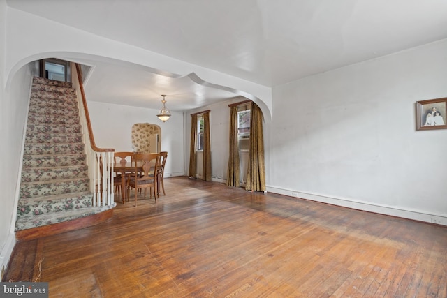 unfurnished living room featuring hardwood / wood-style flooring