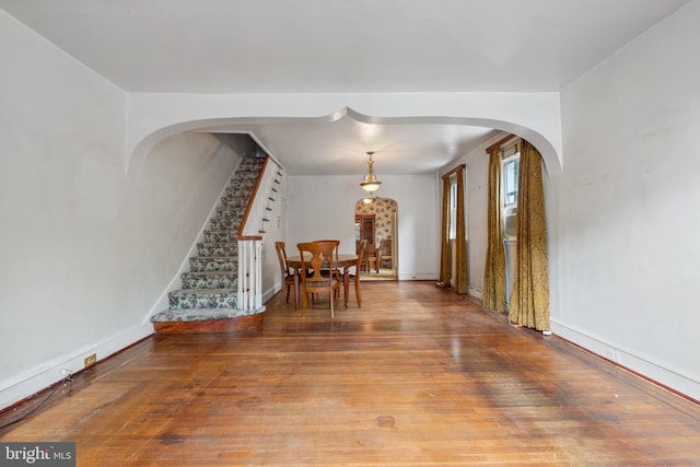 unfurnished dining area with wood-type flooring