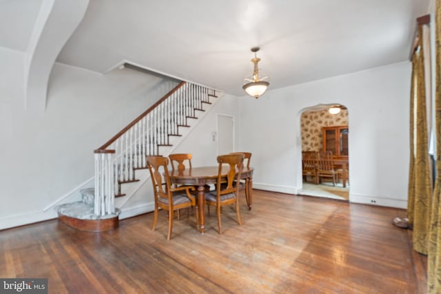 dining space with hardwood / wood-style floors