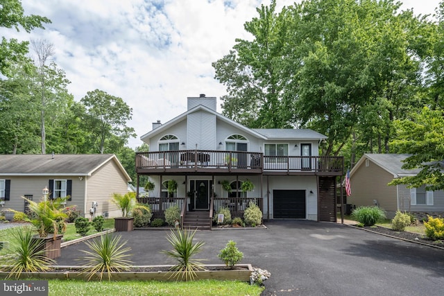 view of front of house featuring covered porch and a garage