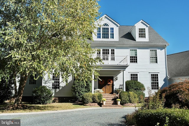 view of front of house with a balcony