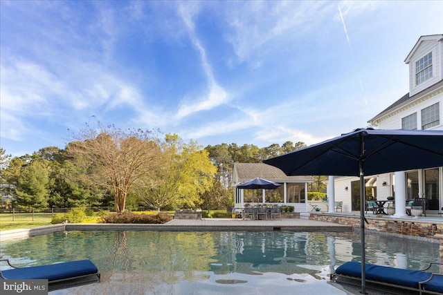 view of swimming pool with a patio area