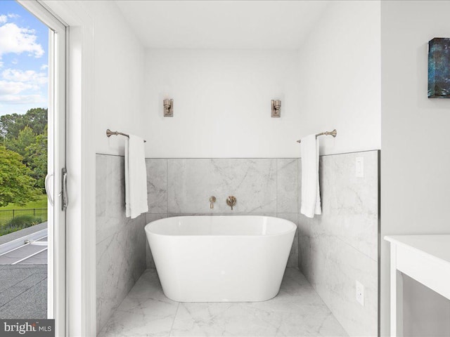 bathroom featuring tile walls and tile floors