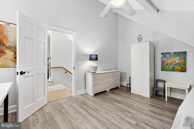 bedroom with lofted ceiling with beams, light wood-type flooring, and ceiling fan