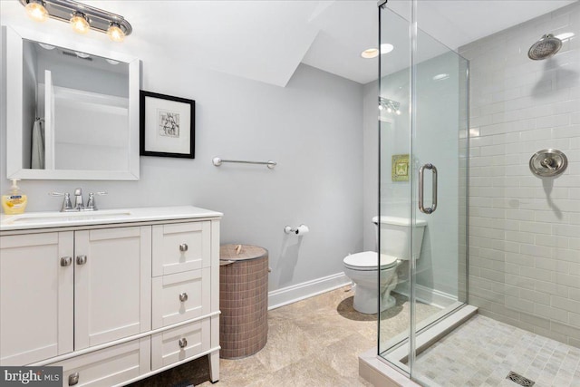 bathroom with walk in shower, vanity, toilet, and tile floors