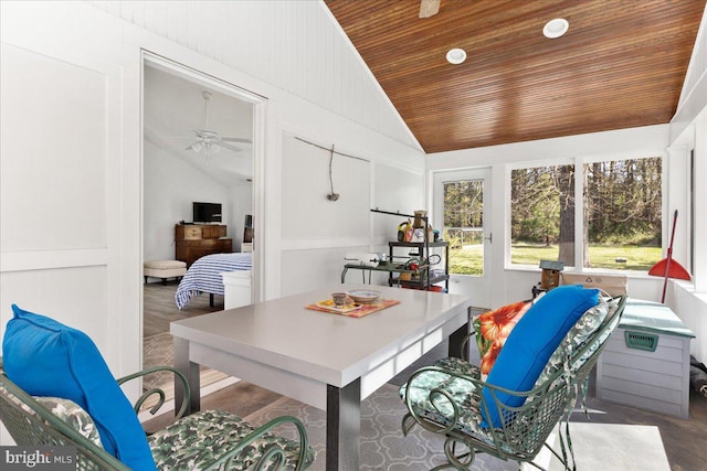 sunroom featuring vaulted ceiling, ceiling fan, and wooden ceiling