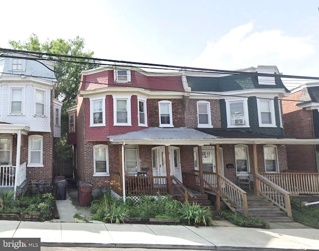 multi unit property featuring a porch