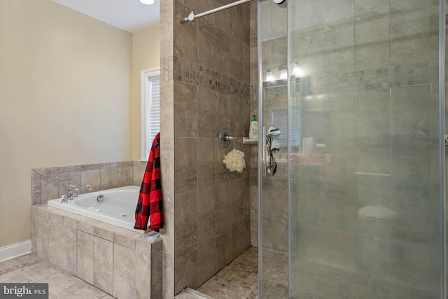 bathroom featuring tile flooring and independent shower and bath