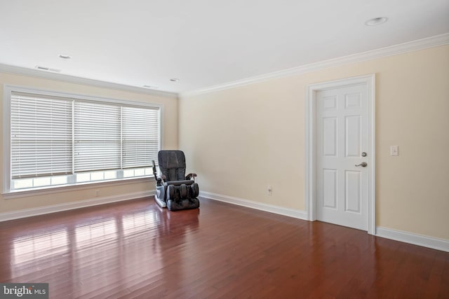 unfurnished room with ornamental molding and dark hardwood / wood-style floors