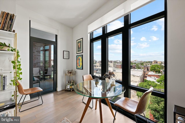 dining area with plenty of natural light and light hardwood / wood-style floors