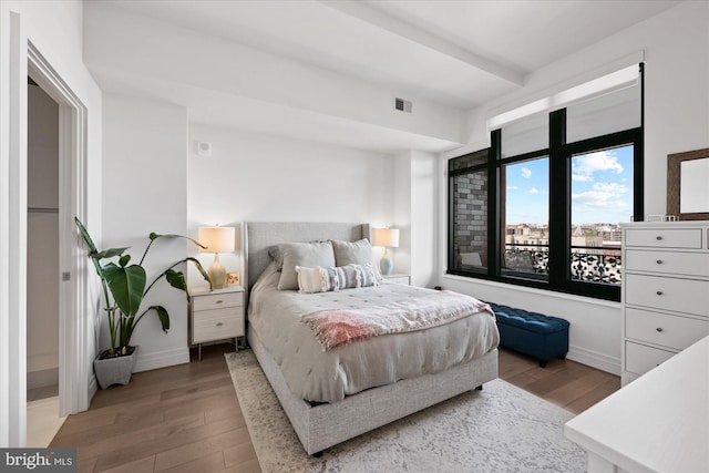 bedroom with wood-type flooring