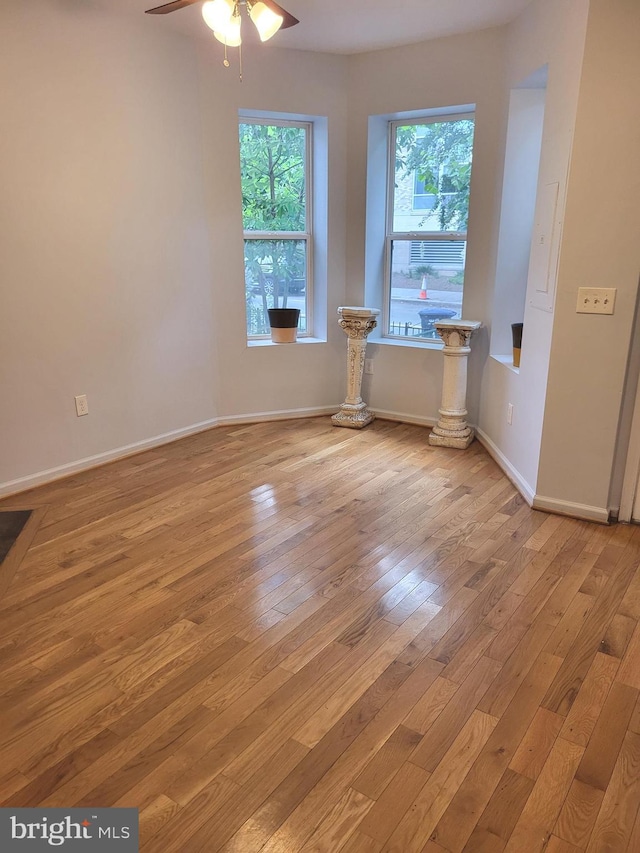 empty room with light hardwood / wood-style floors and ceiling fan