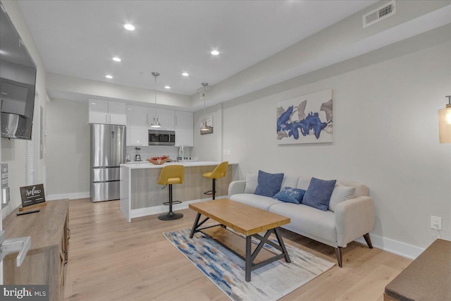 living room featuring light hardwood / wood-style floors