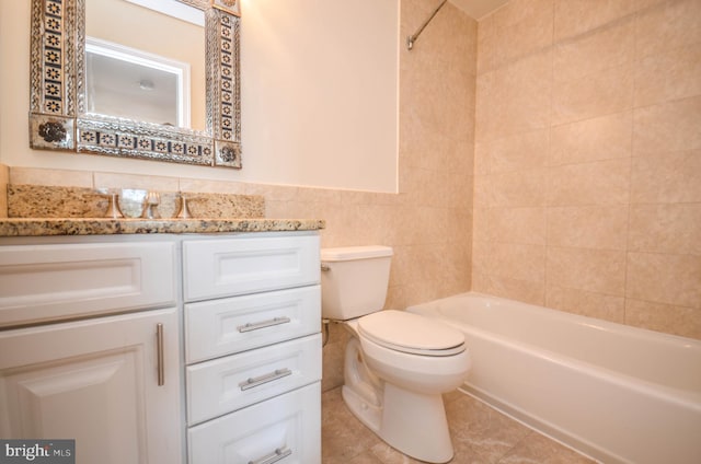 full bathroom featuring tile flooring, tile walls, shower / washtub combination, vanity with extensive cabinet space, and toilet