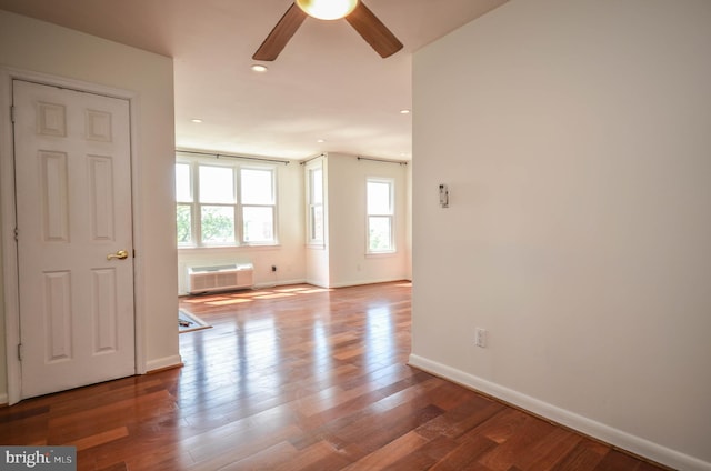 empty room featuring ceiling fan and wood-type flooring