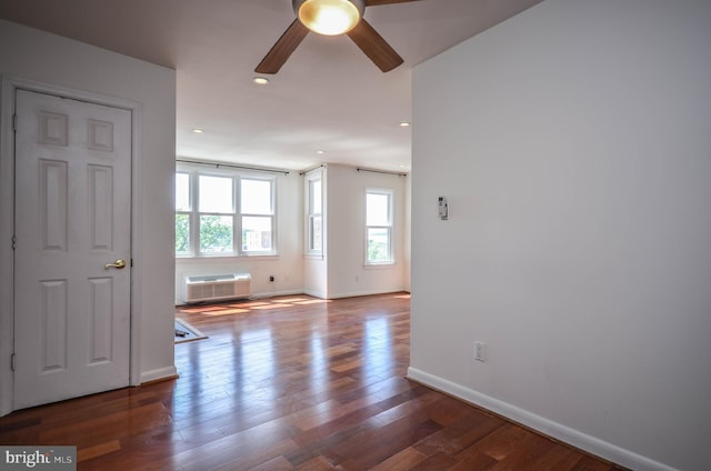 unfurnished room featuring ceiling fan and hardwood / wood-style flooring