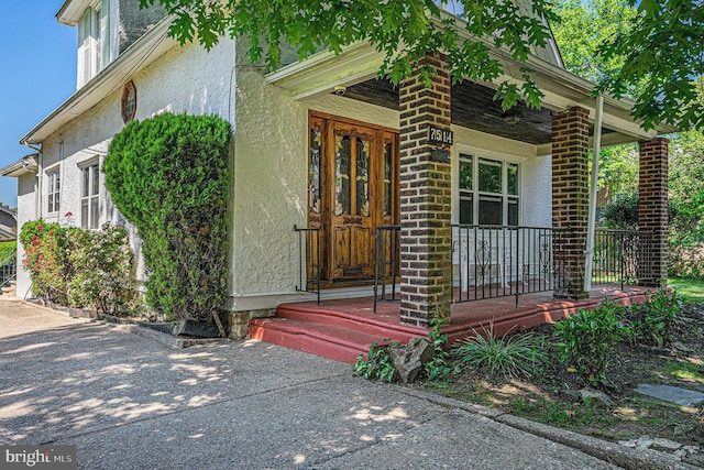 entrance to property with covered porch