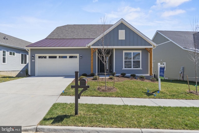 view of front of property with a garage and a front lawn