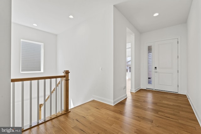 foyer entrance featuring hardwood / wood-style floors