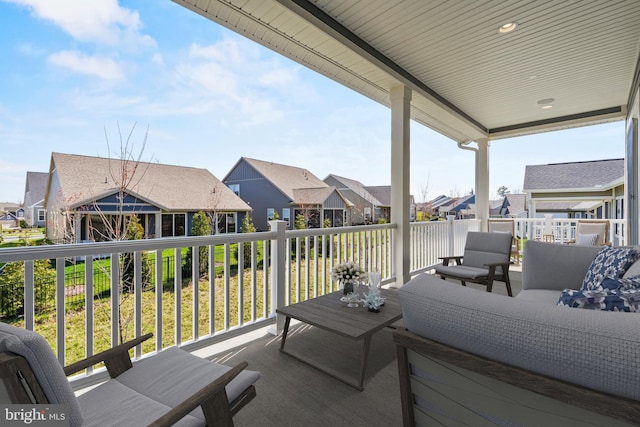 deck with an outdoor living space, a gazebo, and a lawn