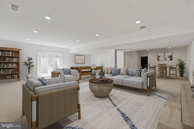 carpeted living room featuring french doors