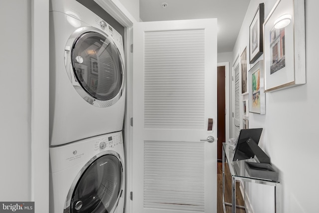 laundry room with stacked washer and dryer