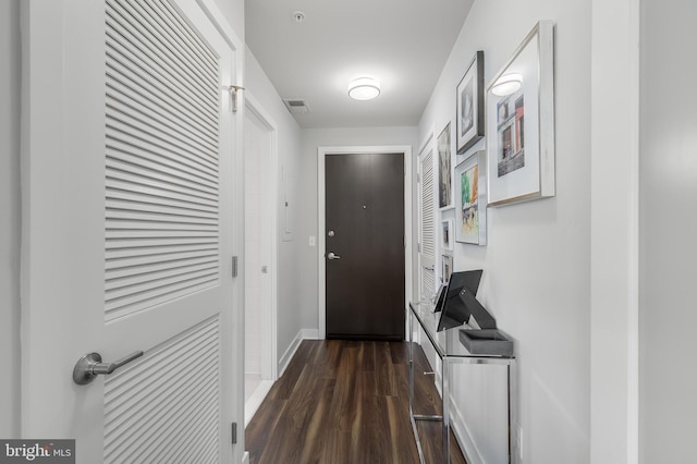 entryway with dark hardwood / wood-style floors