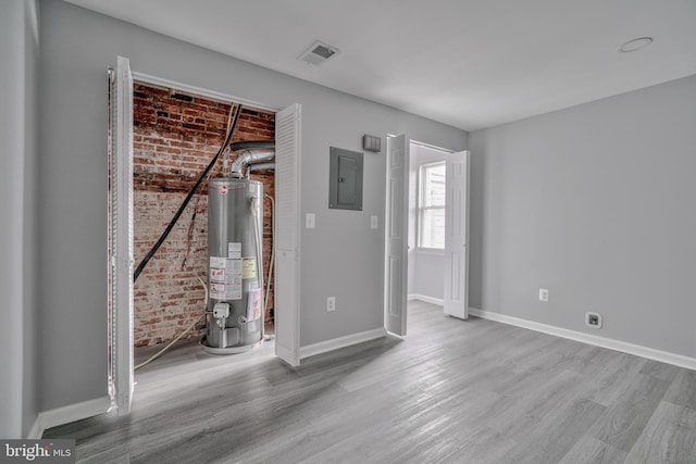 interior space featuring electric panel and gas water heater