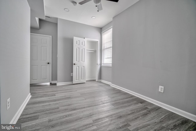 unfurnished bedroom featuring ceiling fan and light wood-type flooring