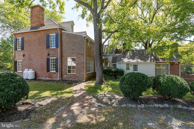 1791 Warrenton Rd, Fredericksburg, VA 22406 - view of side of home with brick siding and a chimney