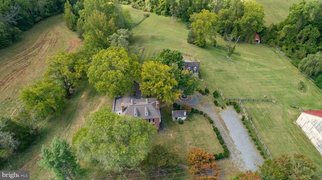 birds eye view of property with a rural view