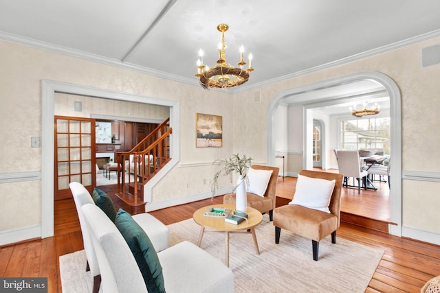 1791 Warrenton Rd, Fredericksburg, VA 22406 - living area featuring a chandelier, arched walkways, wood-type flooring, ornamental molding, and stairs