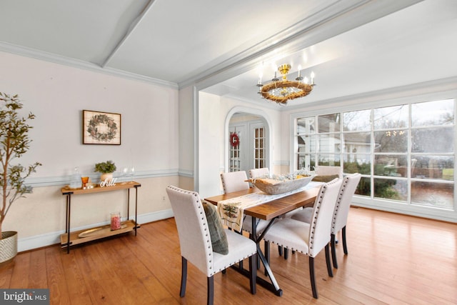 1791 Warrenton Rd, Fredericksburg, VA 22406 - dining space with a chandelier, wood-type flooring, arched walkways, and crown molding