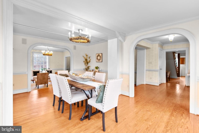 1791 Warrenton Rd, Fredericksburg, VA 22406 - dining room featuring arched walkways, a chandelier, wood finished floors, and ornamental molding