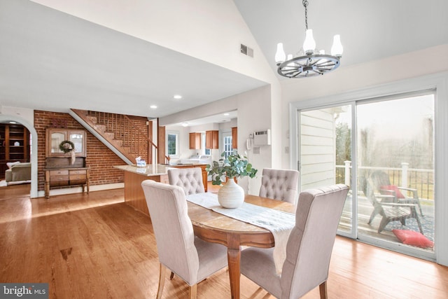 1791 Warrenton Rd, Fredericksburg, VA 22406 - dining space featuring a chandelier, stairs, light wood-style flooring, vaulted ceiling, and recessed lighting
