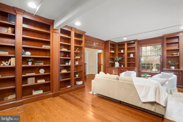 entryway with hardwood / wood-style flooring and ornamental molding