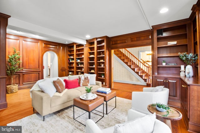 1791 Warrenton Rd, Fredericksburg, VA 22406 - living area featuring stairs, arched walkways, wood finished floors, built in features, and recessed lighting