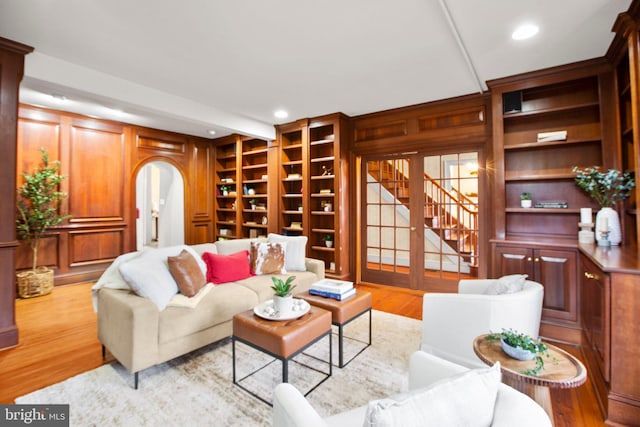 1791 Warrenton Rd, Fredericksburg, VA 22406 - living area featuring built in features, stairway, wood finished floors, arched walkways, and recessed lighting