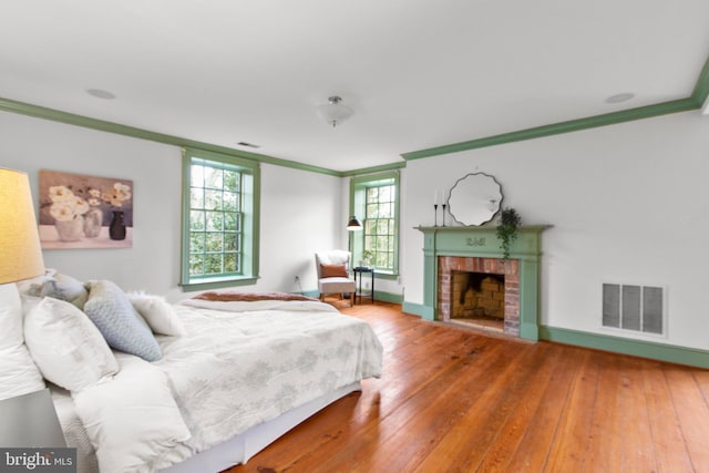 1791 Warrenton Rd, Fredericksburg, VA 22406 - bedroom featuring ornamental molding, hardwood / wood-style flooring, and a fireplace