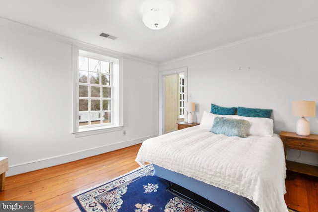 1791 Warrenton Rd, Fredericksburg, VA 22406 - bedroom with wood finished floors and crown molding