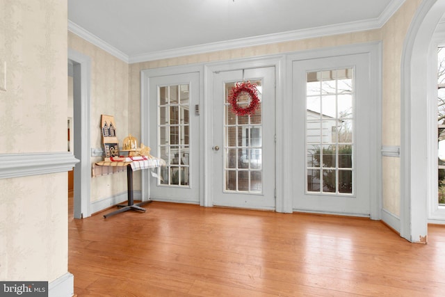 1791 Warrenton Rd, Fredericksburg, VA 22406 - doorway to outside featuring hardwood / wood-style flooring, ornamental molding, wallpapered walls, and arched walkways