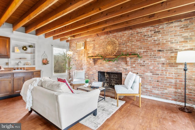 1791 Warrenton Rd, Fredericksburg, VA 22406 - living area with a brick fireplace, light wood finished floors, a wooden ceiling with exposed beams, and brick wall