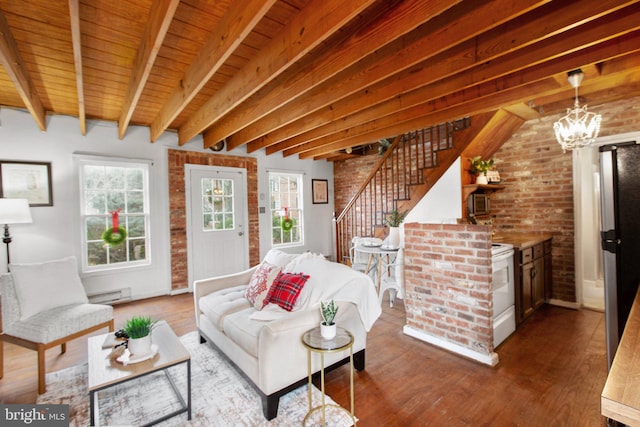 1791 Warrenton Rd, Fredericksburg, VA 22406 - living room with a baseboard radiator, brick wall, stairs, wood finished floors, and a wood ceiling with exposed beams